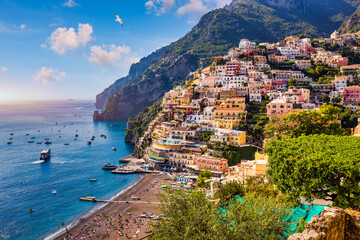 View of Positano with comfortable beach and blue sea on Amalfi Coast in Campania, Italy. Positano village on the Amalfi Coast, Salerno, Campania. Beautiful Positano, Amalfi Coast in Campania. - obrazy, fototapety, plakaty