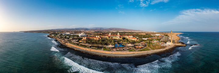 Aerial drone of the popular resort town of Meloneras, with hotels and restaurants, near the Maspalomas dunes in Gran Canaria, Canary Islands, Spain