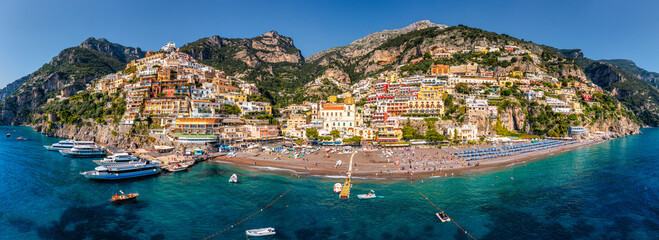Aerial view of Positano with comfortable beach and blue sea on Amalfi Coast in Campania, Italy....