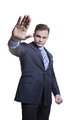 A successful businessman shows a stop sign gesture with his hand