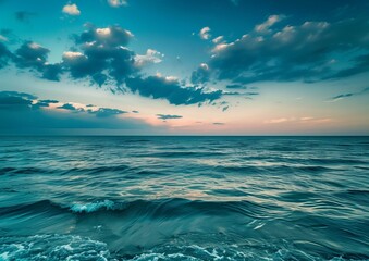 Fototapeta premium Tranquil Sea at Twilight with Blue Skies and Fluffy Clouds