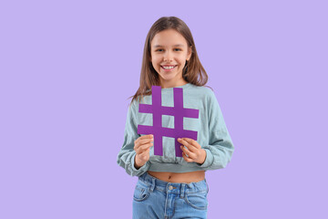 Cute teenage girl with hashtag on lilac background