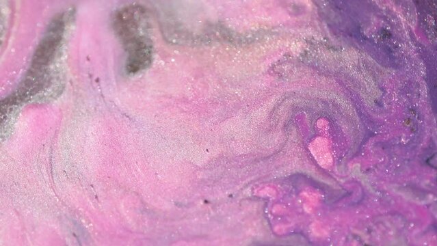 Abstract fluid art background light purple and lilac colors. Liquid marble. Acrylic painting with violet shiny gradient. Alcohol ink backdrop with pearl wave pattern