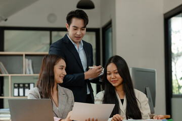 a group of businesspeople is brainstorming in the modern office, working together as a teamwork to share an idea, they are talking about what strategy that they will use for project