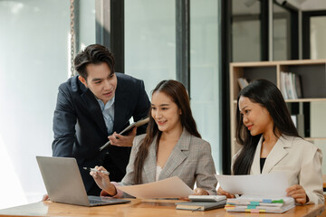 a group of businesspeople is brainstorming in the modern office, working together as a teamwork to share an idea, they are talking about what strategy that they will use for project