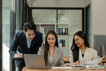 a group of businesspeople is brainstorming in the modern office, working together as a teamwork to share an idea, they are talking about what strategy that they will use for project