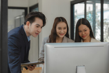 a group of businesspeople is brainstorming in the modern office, working together as a teamwork to share an idea, they are talking about what strategy that they will use for project