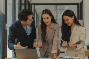 a group of businesspeople is brainstorming in the modern office, working together as a teamwork to share an idea, they are talking about what strategy that they will use for project