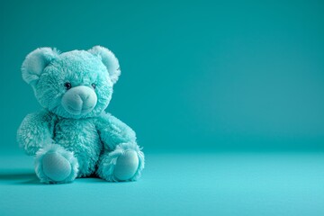 A cute blue teddy bear sits on a blue background with a sweet smile, ideal for cuddling on cold nights. Perfect for childrens books, packaging, or as a special gift