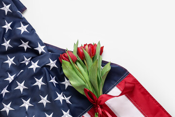 Beautiful tulip flowers and flag of USA on light background. Memorial Day celebration