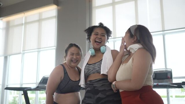 chubby women workout at fitness center.