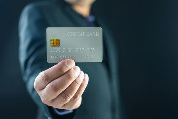 Businessman holding his white credit card