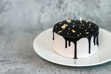 Elegance Luxury Tart Cake with Melting Chocolate Topped with Gold Isolated on Gray Backgroung
