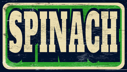 Aged and distressed spinach sign on wood