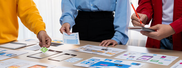 Panorama banner of startup company employee planning on user interface prototype for mobile...