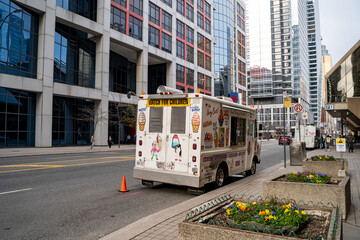 Fototapeta premium The ice cream truck on Front Street West in downtown Toronto. Toronto, Canada - April 29, 2024.