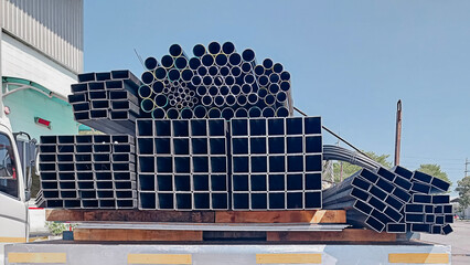 Black steel pipe, C-shaped, gutter, flat pipe, and square pipe. Steel construction materials on...