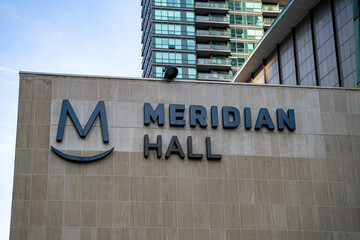 Fototapeta premium Meridian Hall sign. Meridian Hall is a performing arts venue in Toronto, Ontario, and it is the country's largest soft-seat theatre. Toronto, Canada - April 29, 2024.