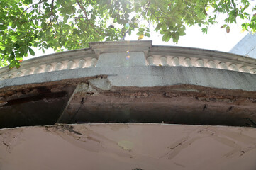 Closeup of Cement panels of the mezzanine balcony It cracked and fell to the ground below outside the building at Thailand.