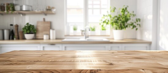 Clean and bright modern kitchen interior background with a beautiful wooden table top and blurred bokeh effect, ideal for product montage.