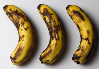 Three rotten banana isolated on white background