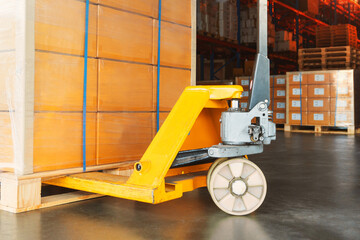 Package Boxes Wrapped Plastic on Pallets and Hand Pallet Truck. Forklift Loader, Hand Lift. Distribution Warehouse Shipping. Supply Chain, Supplies Shipment. Warehouse Logistics and Transport.	
