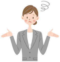 困った表情のグレーのスーツの女性　お手上げ　呆れる　トラブル　ビジネス