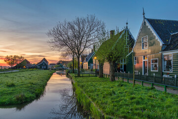 Dutch traditional house sunrise at Zaanse Schans Village, Netherlands