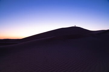 A dusk of panoramic sand dune at Mhamid el Ghizlane in Morocco wide shot