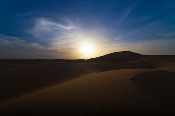 A dusk of panoramic sand dune at Mhamid el Ghizlane in Morocco wide shot