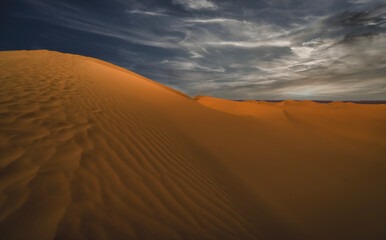 A dusk of panoramic sand dune at Mhamid el Ghizlane in Morocco wide shot