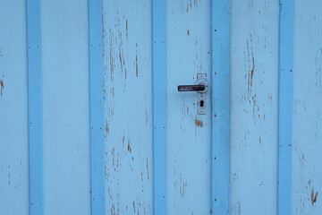 Blue door with metal handle design