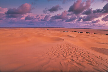 Fototapeta na wymiar A dusk of sand dune near the camp at Mhamid el Ghizlane in Morocco