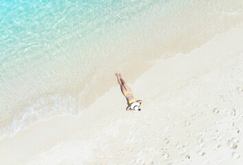 Happy of summer with young woman relaxation  as lying on the beach  in Maldives