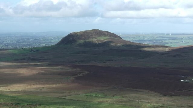 Slemish Mountain in County Antrim Northern Ireland. Aerial 50fps UHD