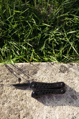 multitool on the background of the garden