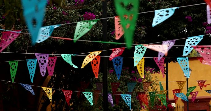 Papel picado waves in the wind in historic downtown Bernal, Quer&eacute;taro, Mexico.