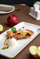 strudel with apple and ice cream in a restaurant