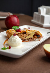 strudel with apple and ice cream in a restaurant