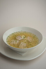 chicken soup on a gray background
