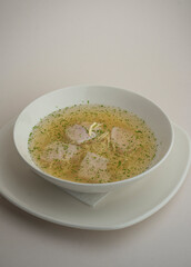chicken soup on a gray background