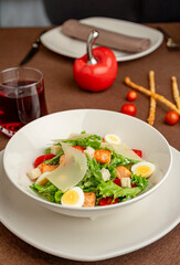 Caesar salad with salmon, parmesan and quail eggs