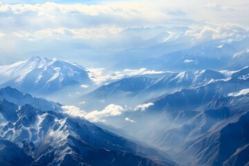 Majestic Mountain Range Captured from Soaring Bird s Perspective Showcasing Awe Inspiring Peaks Valleys and Untamed Wilderness
