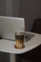 Closeup of Iced Caramel Macchiato at the coffee shop, Caramel Macchiato is a classic macchiato beverage. It consists of vanilla syrup, espresso, steamed milk, foam, and caramel drizzle