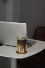 Closeup of Iced Caramel Macchiato at the coffee shop, Caramel Macchiato is a classic macchiato beverage. It consists of vanilla syrup, espresso, steamed milk, foam, and caramel drizzle