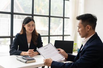 Job application concept: Manager and job applicant shake hands after a job interview. Job...