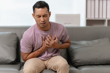 Man touching heart with heart disease concept suffering Contractions and difficulty breathing Chest...
