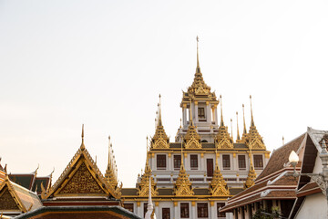 Fototapeta premium golden spires on top of buddhist thai temple in bangkok