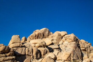 Joshua Tree's rugged rocks against an endless blue sky