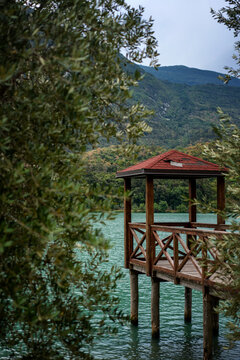 Wooden  pavilion with boardwalk on a lake